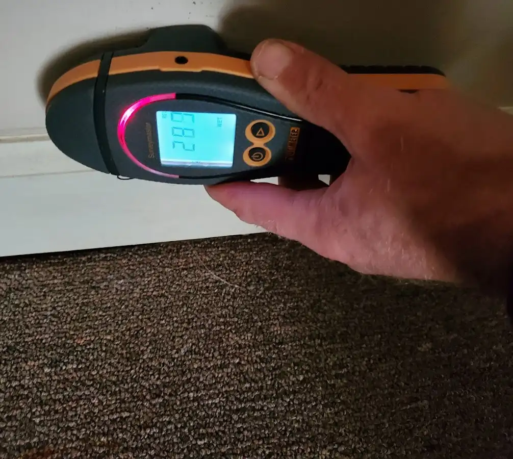 Moisture detection at baseboard during Storm Damage Restoration in St. Joseph